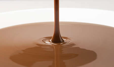 Close-up of pouring melted chocolateの写真素材