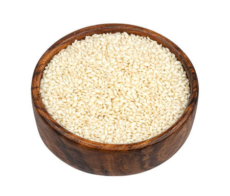 Risotto rice isolated on white background, top viewの写真素材