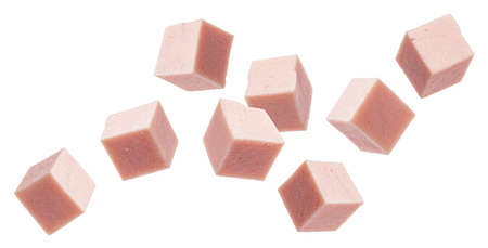 Boiled sausage cubes isolated on white background