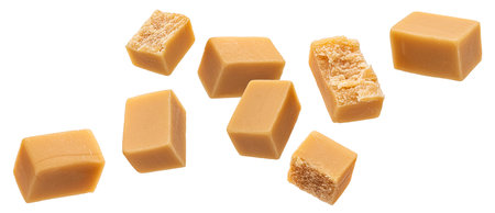 Caramel candies isolated on white backgroundの写真素材