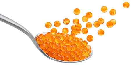 Red caviar in spoon isolated on white background, full depth of fieldの写真素材
