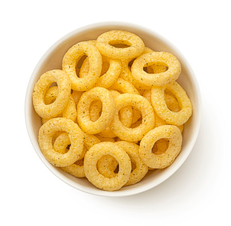 Corn onion rings in bowl isolated on white background, top viewの写真素材