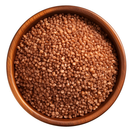 Buckwheat grains in wooden bowl isolated, top view, AI generatedの素材