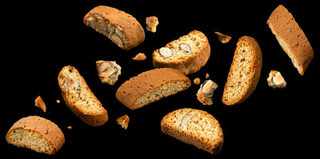 Falling cantuccini biscuits, Italian almond cookies on black backgroundの写真素材