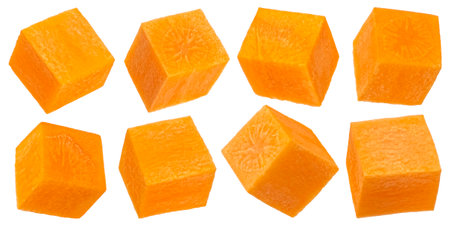 Fresh carrot cubes isolated on white backgroundの写真素材