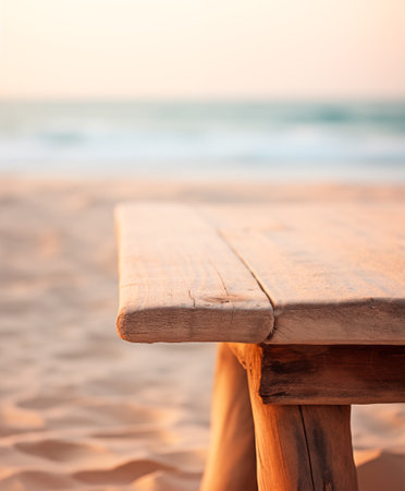 Wooden table with copy space, blurred ocean background, empty wood desk surface, product display montage, sunny beach summer backdrop. AI generatedの素材