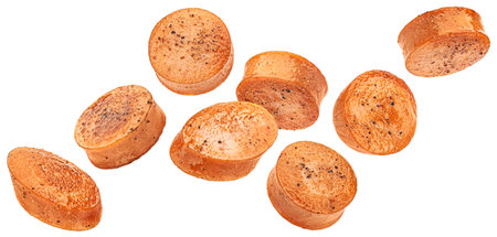 Falling fried sausage slices isolated on white backgroundの写真素材