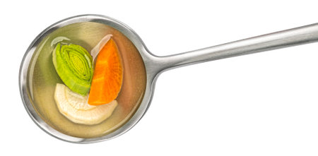 Spoon of vegetable broth isolated on white background, top view, full depth of fieldの写真素材