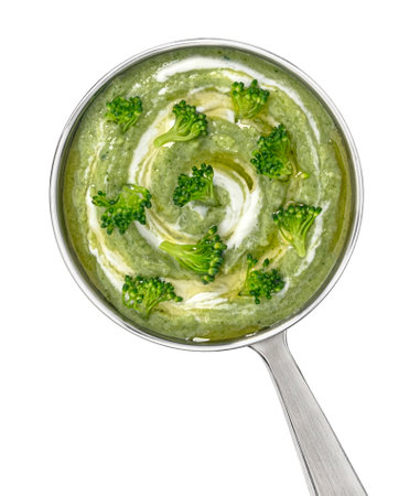 Broccoli cream soup in ladle isolated on white backgroundの写真素材
