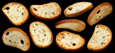 Bruschetta crackers, round bread croutons isolated on black backgroundの写真素材