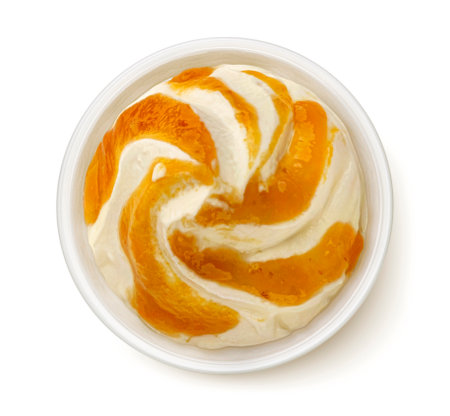 Bowl of yogurt with peach jam isolated on white background, top view, flat layの写真素材