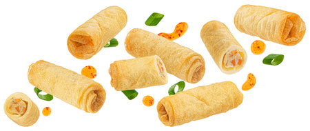 Traditional fried spring rolls with hot chili pepper sauce drops isolated on white backgroundの写真素材