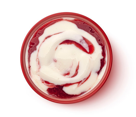 Bowl of yogurt with berry jam swirl isolated on white background, top viewの写真素材