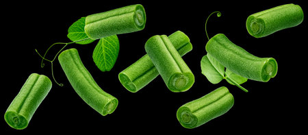 Chopped green beans isolated on black backgroundの写真素材