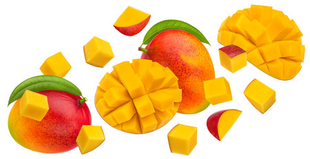 Falling mango fruits slices isolated on white background with clipping pathの写真素材