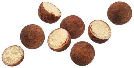 Falling marzipan potatoes isolated on white background with clipping pathの写真素材