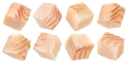 Fresh fish cubes, raw cod fillet isolated on white background with clipping pathの写真素材