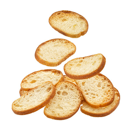 Falling bruschetta crackers, round bread croutons isolated on white background, full depth of fieldの写真素材