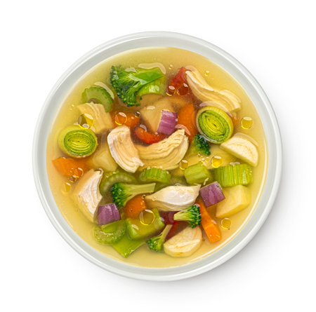 Chicken soup with vegetables isolated on white background, top view, package design elementの写真素材