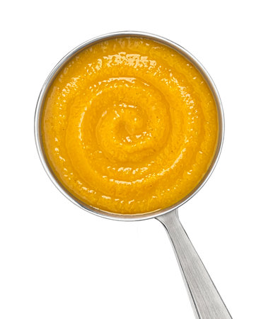 Ladle with pumpkin cream soup isolated on white background with clipping path, top viewの写真素材