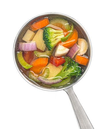 Ladle with vegetable soup isolated on white background, top viewの写真素材