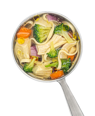 Chicken noodle soup in ladle isolated on white background, top view, package design elementの写真素材