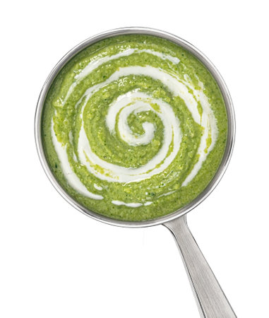 Broccoli cream soup in ladle isolated on white background with clipping path, top view, full depth of fieldの写真素材