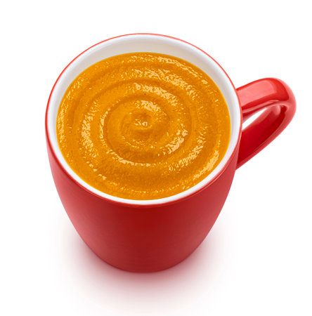 Instant pumpkin cream soup in red cup isolated on white background, top view, package design elementの写真素材