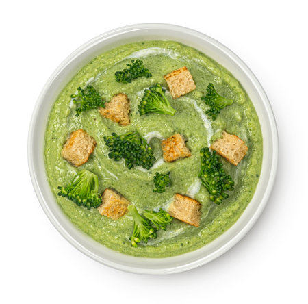 Broccoli cream soup with croutons isolated on white background, top view, package design elementの写真素材