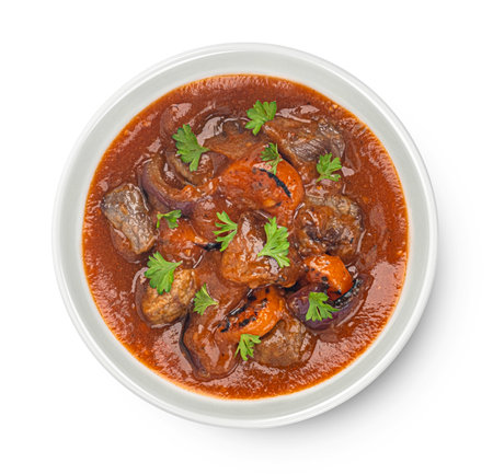 Beef stew with potatoes, carrots and herbs isolated on white background, top viewの写真素材