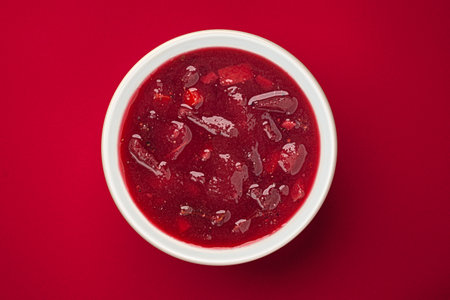Borscht, beetroot soup on red background with copy space, top viewの写真素材