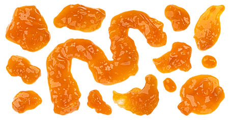 Splashes of fruit jam, spilled peach jam isolated on white background, top viewの写真素材