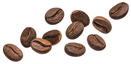 Coffee beans in the air close up, isolated on white background, full depth of fieldの写真素材