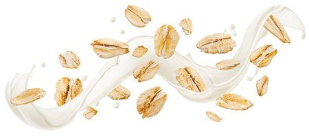 Falling oat flakes, oatmeal with milk splash isolated on white background with clipping path, package design conceptの写真素材