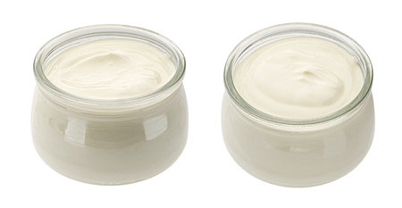 Glass jar of fresh homemade organic yogurt isolated on white background, full depth of fieldの写真素材