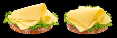 Gouda slices on white bread, cheese sandwich with salad leaves isolated on black background, full depth of fieldの写真素材