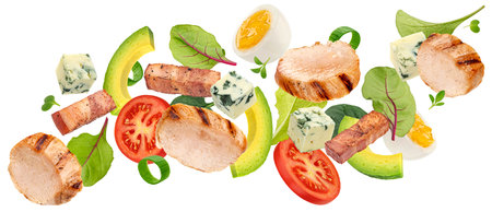 Falling Cobb salad with grilled chicken, eggs, tomato, avocado and bacon isolated on white background with clipping path, package design elementの写真素材