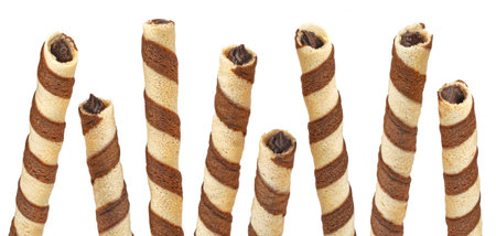 Waffle rolls, striped chocolate and vanilla wafer sticks isolated on white background, full depth of field, package design elementの写真素材