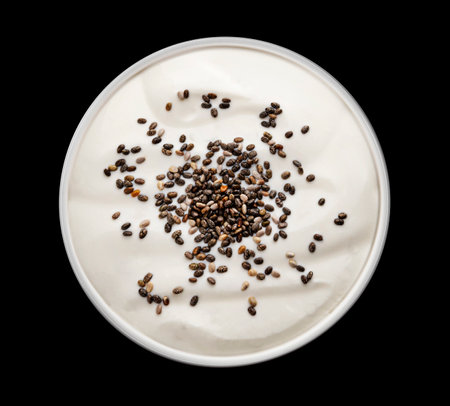 Bowl of yogurt with chia seeds isolated on black background, top viewの写真素材