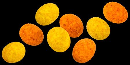 Falling coated peanuts isolated on black background, collectionの写真素材
