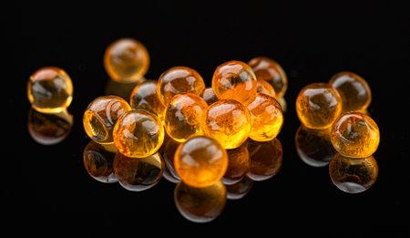 Red caviar isolated on black background, premium salmon caviar close-up, full depth of field, macroの写真素材
