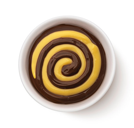 Bowl of chocolate and vanilla cream swirl isolated on white background, top viewの写真素材