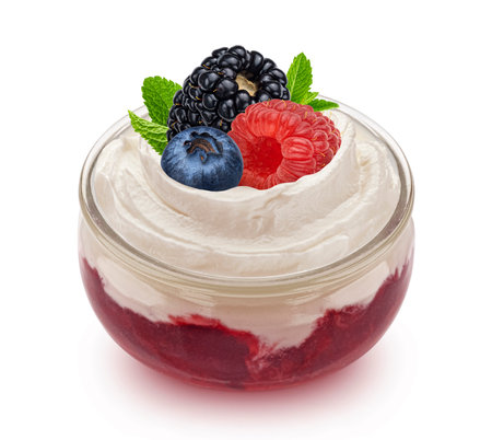 Layered dessert, glass jar of yogurt with berry jam isolated on white backgroundの写真素材