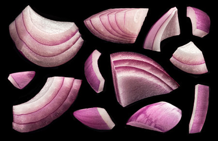 Sliced red onion isolated on black background, full depth of fieldの写真素材