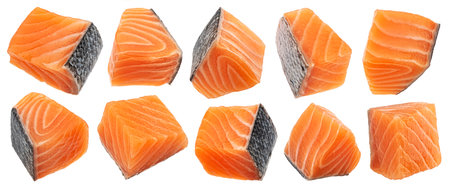 Salmon fillet cubes isolated on white background with clipping pathの写真素材