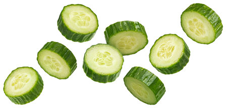 Falling cucumber slices isolated on white background with clipping path, full depth of fieldの写真素材