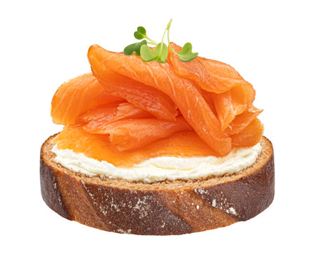 Smoked salmon with cream cheese on rye bread slice isolated on white background with clipping pathの写真素材