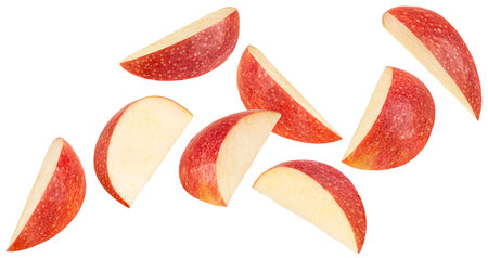 Falling apple slices isolated on white background with clipping path, full depth of fieldの写真素材