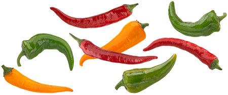 Falling red green and yellow chili peppers isolated on white background with clipping path, full...
