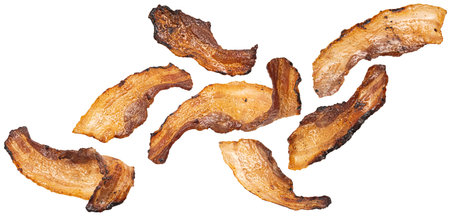 Falling grilled bacon strips isolated on white background with clipping path, full depth of fieldの写真素材